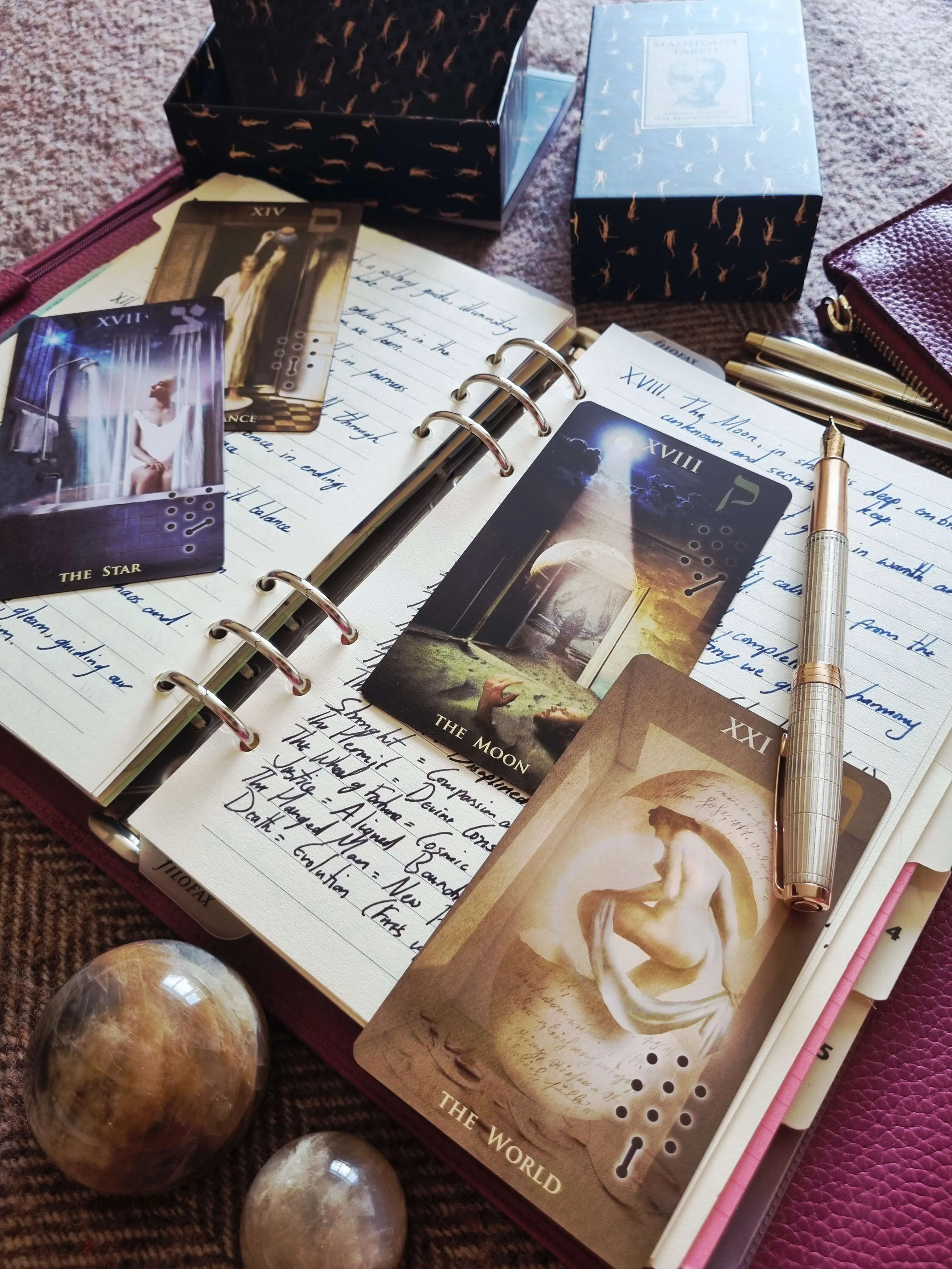 tarot journal with handwritten card meanings, Star, Moon and World cards