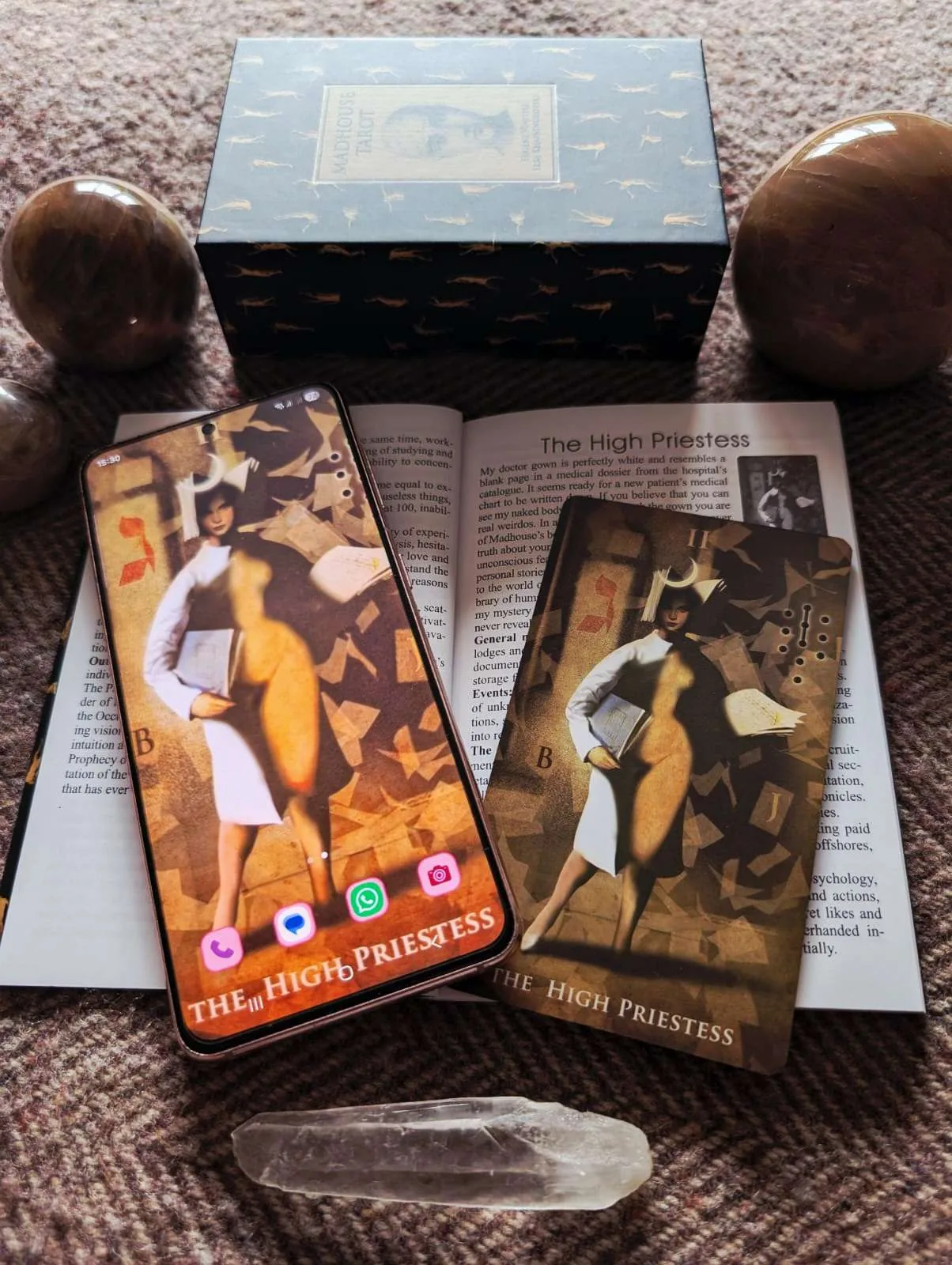tarot card, The High Priestess, set as a phone lock screen beside the matching card
