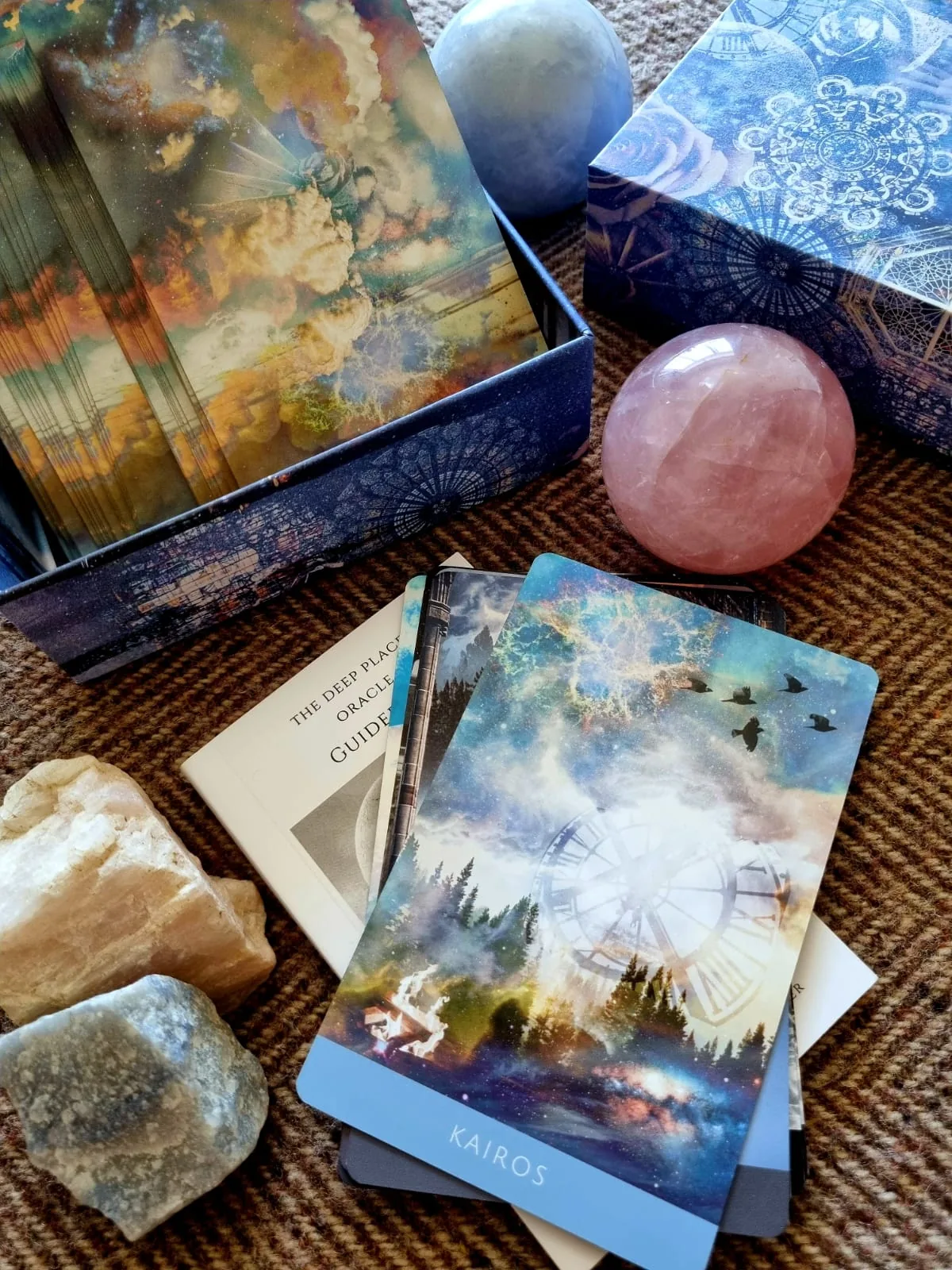 The Deep Place Oracle guidebook and Kairos card with crystal spheres