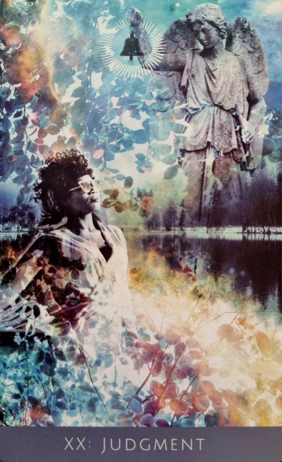 Judgement from the Rooted Remembrance Tarot, a stone angel raising a bell above a figure waking beside still water