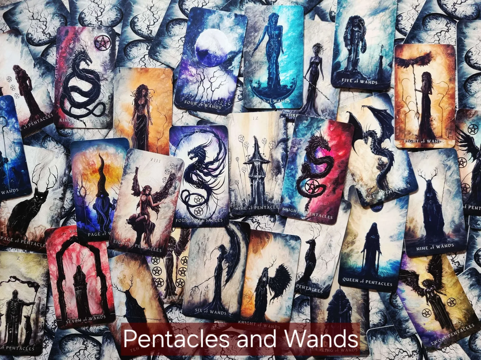 Dark Fantasy Tarot Pentacles and Wands cards spread out for shadow work