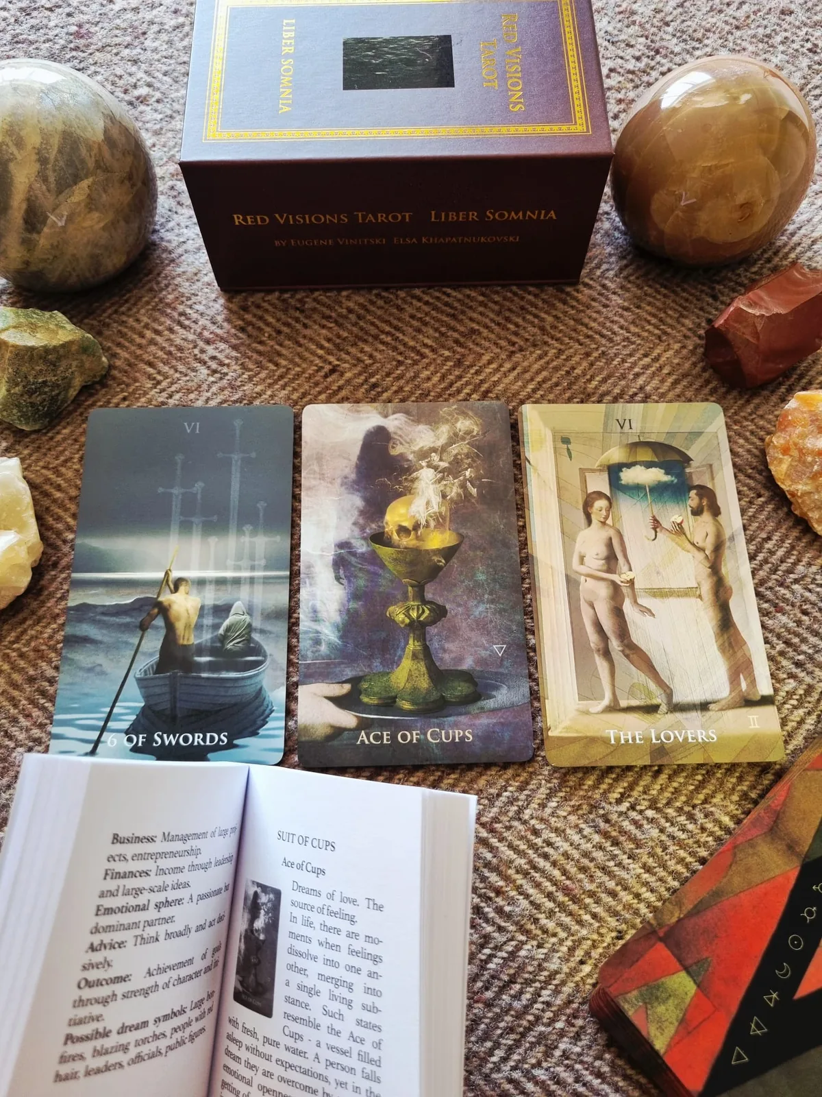 The Liber Somnia companion book open beside the Ace of Swords, Ace of Cups and The Tower