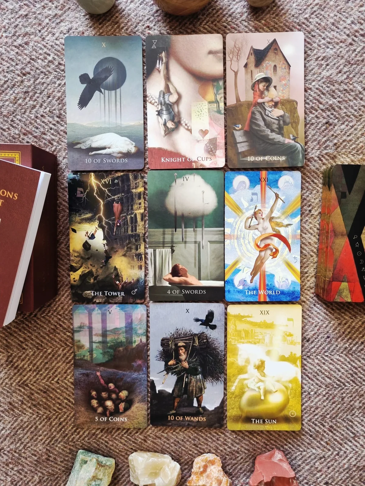 A nine card grid from Liber Somnia Red Visions Tarot showing its dreamlike hand-drawn imagery