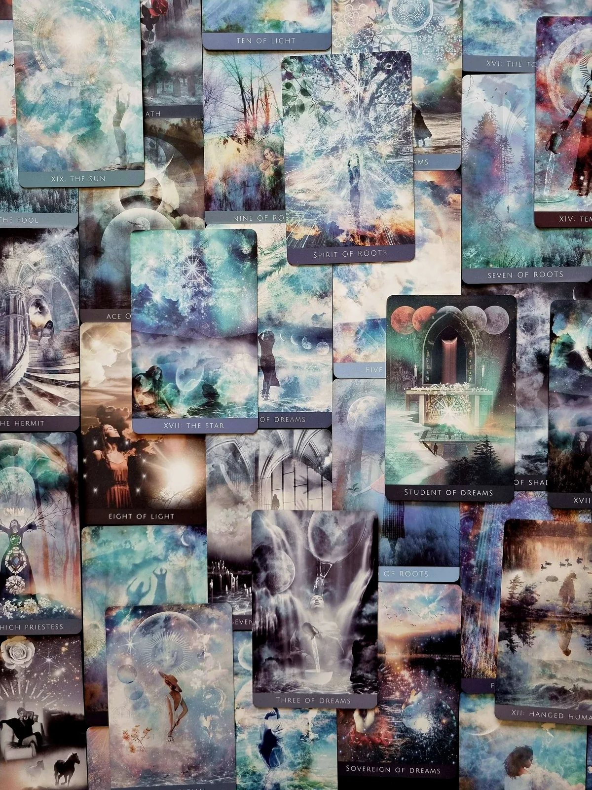 Rooted Remembrance Tarot cards fanned out in a scattered spread