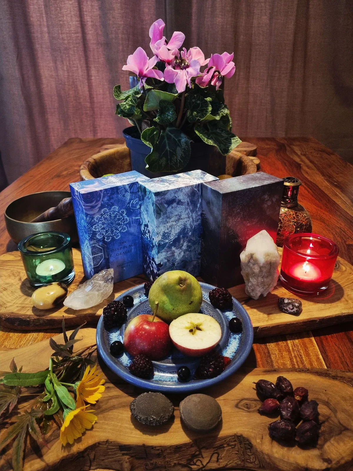 a Mabon altar with candles, crystals and seasonal gathered items