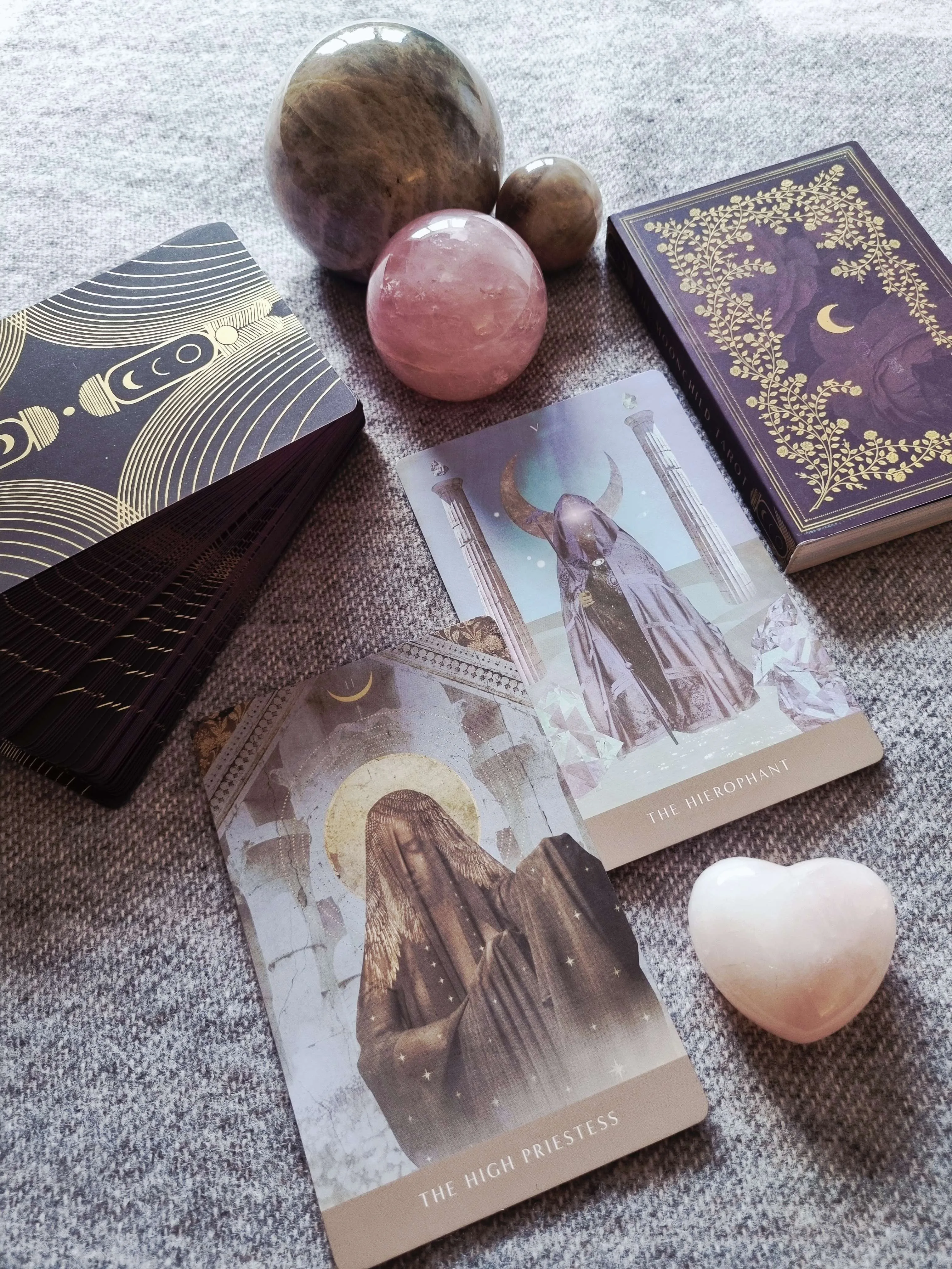 The Moonchild Tarot Shadow Work Edition box beside The High Priestess and The Hierophant cards