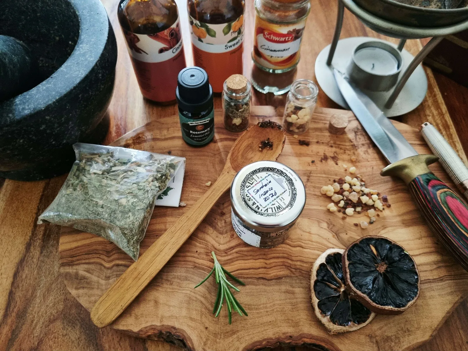 homemade Samhain incense jar with frankincense resin, herbs and dried orange