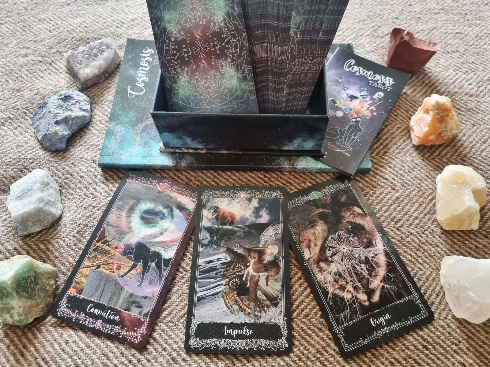 Cosmosis Tarot deck box and guidebook with the Conviction, Impulse and Origin cards