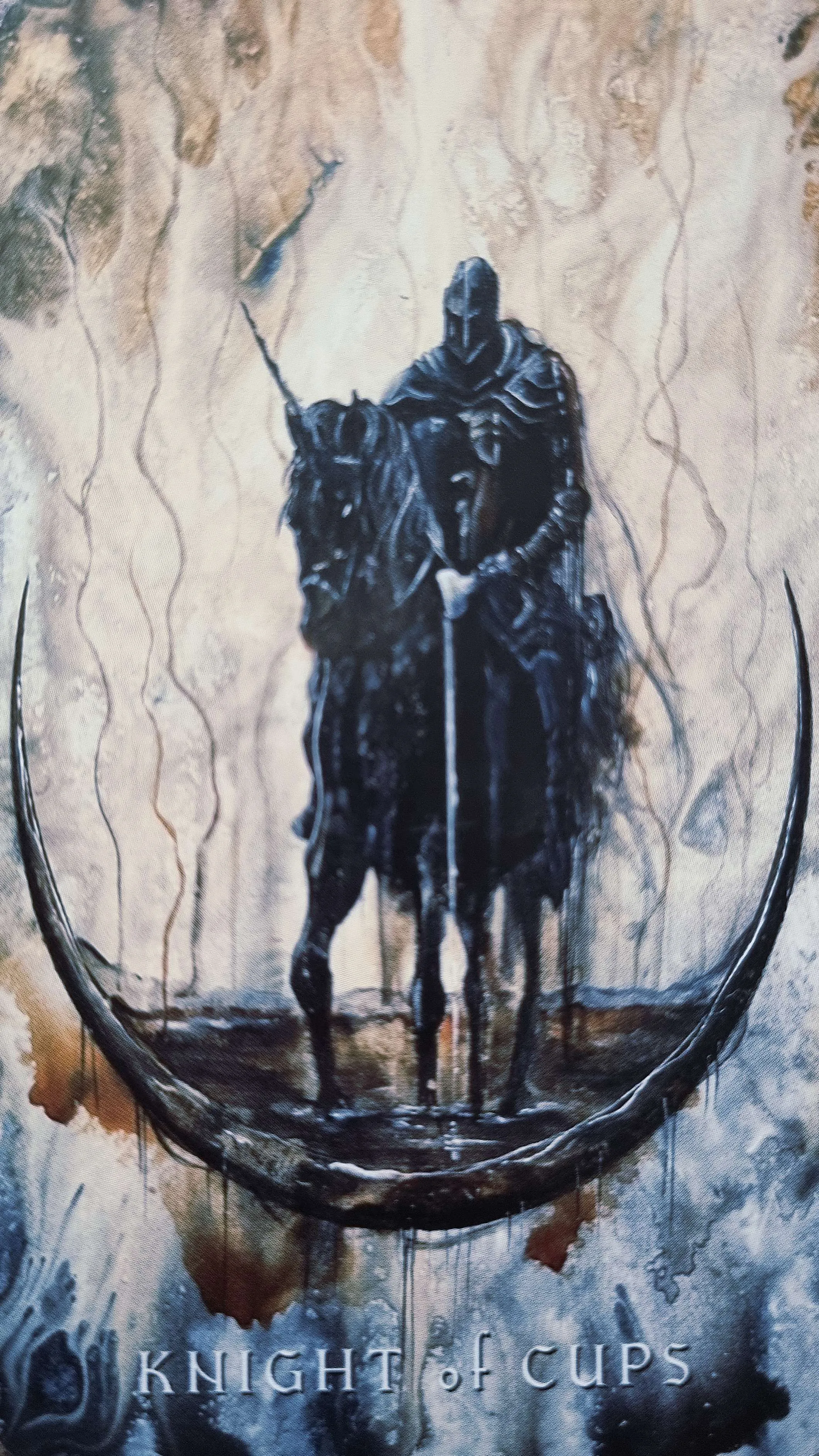 Knight of Cups tarot card, an armoured rider on horseback within a crescent moon