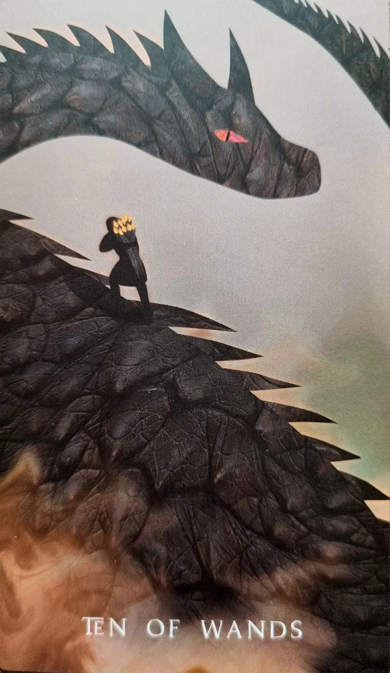 Ten of Wands tarot card, a small figure carrying wands up the spine of a vast black dragon