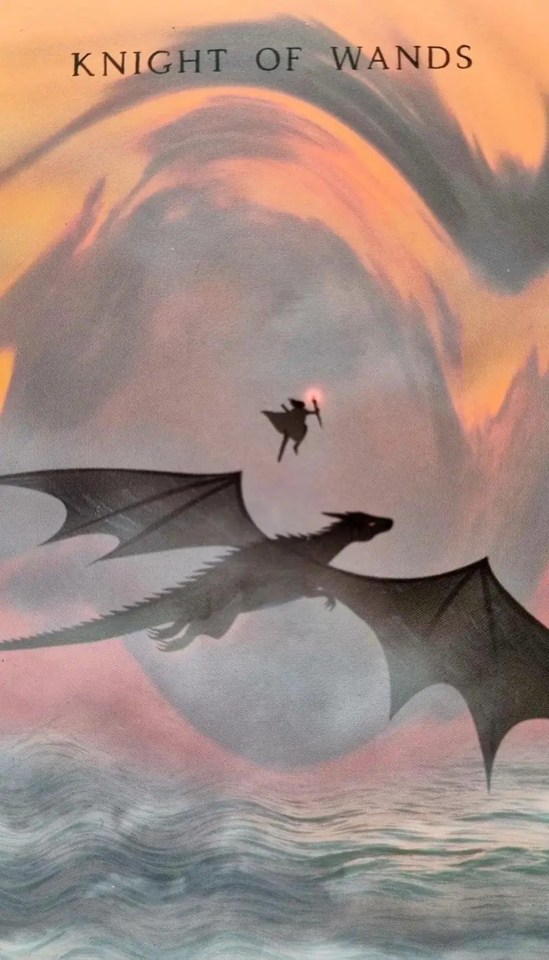 Knight of Wands tarot card, a torchbearer leaping from a flying dragon across a sunset sky