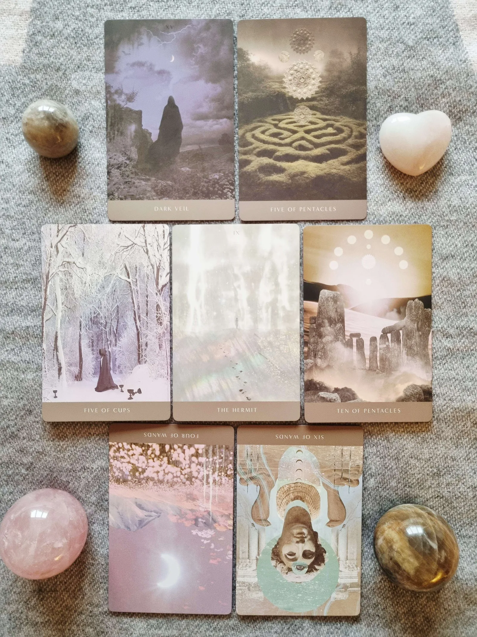 Seven card Meet Your Protector reading from the Moonchild Tarot Shadow Work Edition with The Hermit at the centre and Dark Veil above