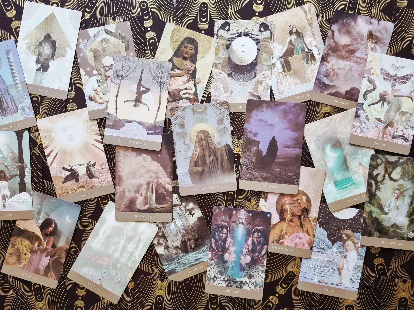 Moonchild Tarot Shadow Work Edition cards fanned out across dark gold patterned card backs